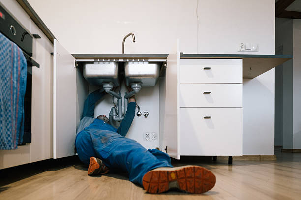 Professional Plumbing technician working in Ferguson, MO